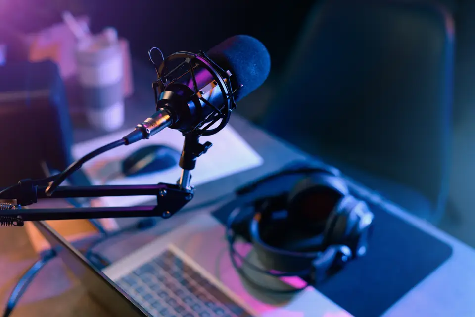 Microphone and headphones on desk