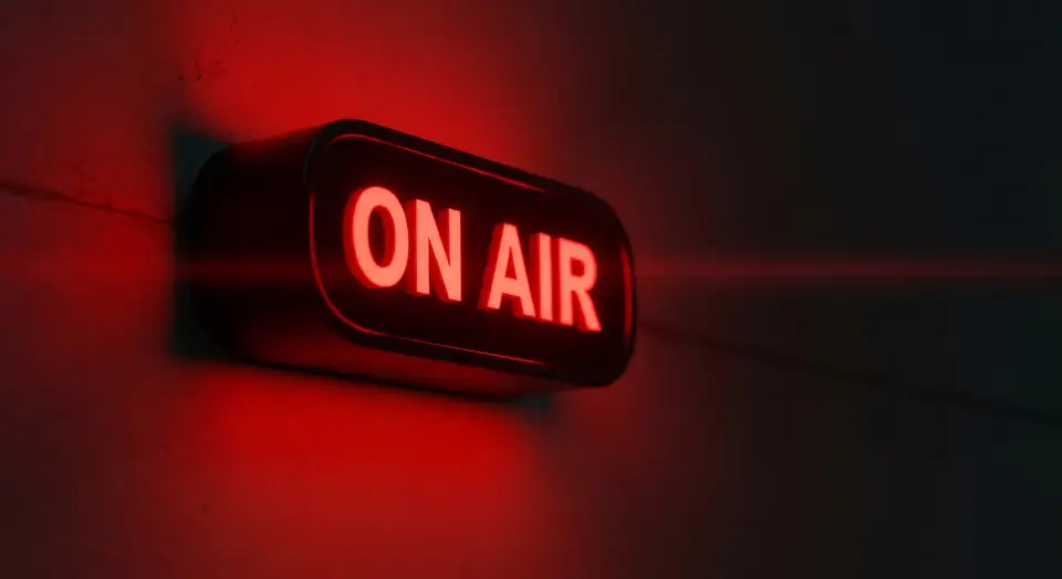 Red 'ON AIR' sign illuminated